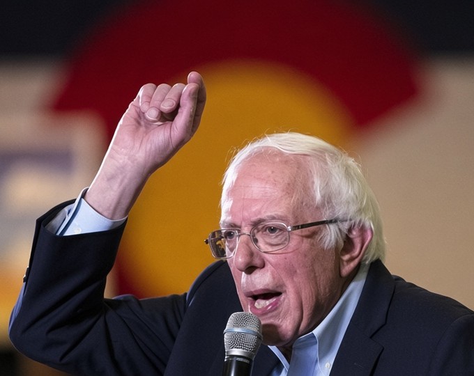 Bernie Sanders speaking into a microphone